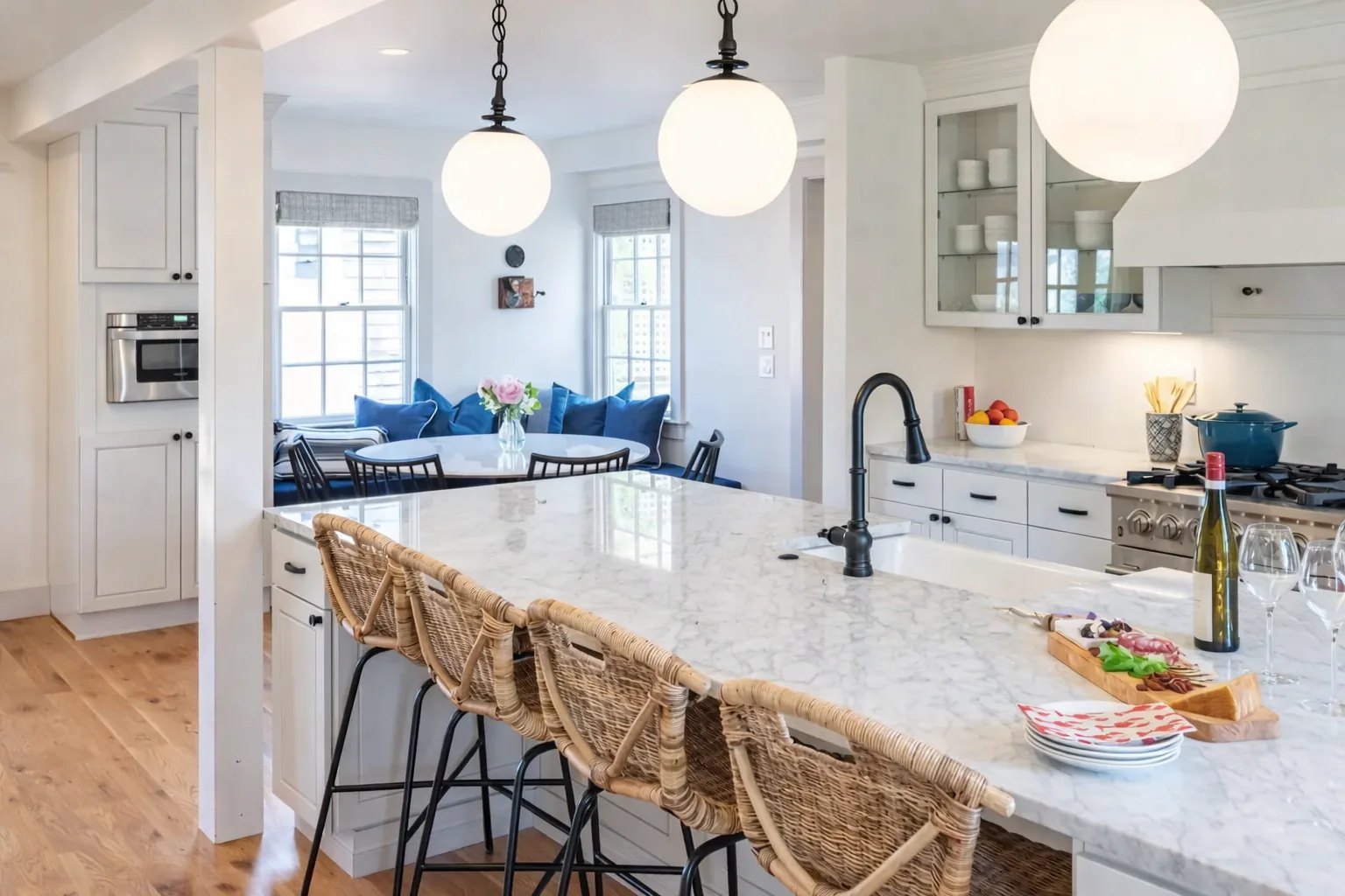 White kitchen island with a stone surface